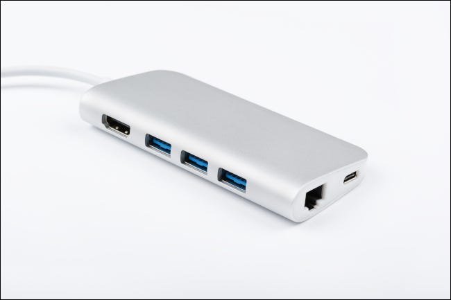 An aluminum, multi-port adapter on white background.