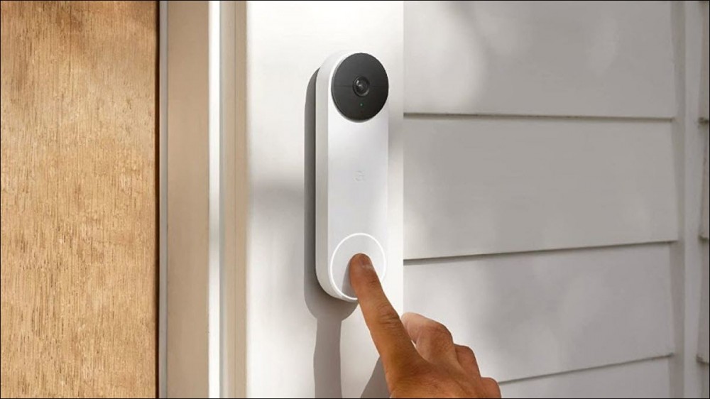 A person ringing a Google Nest doorbell while the spooky chime is enabled.