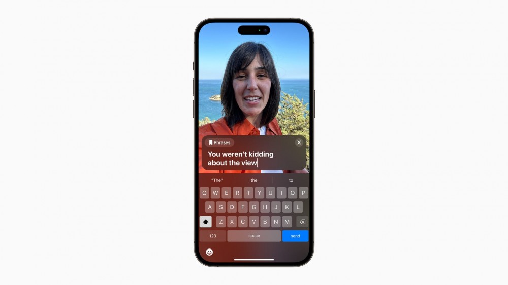 A woman using Live Speech on an iPhone